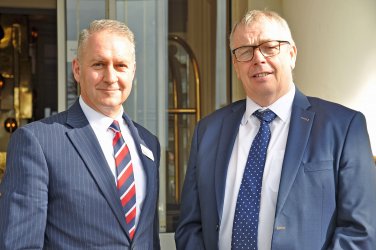 Dorset Chamber chief executive Ian Girling welcomes REIDsteel managing director Simon Boyd